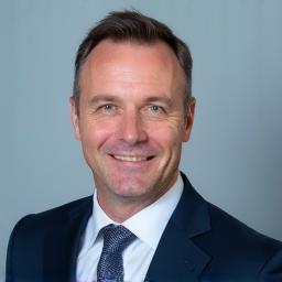 Portrait of Dr. Ing. Hans Müller, CEO of Alpine Wegebau GmbH